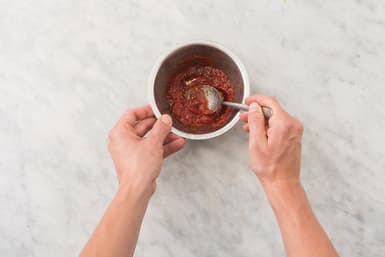 Add flavour to the tomato paste