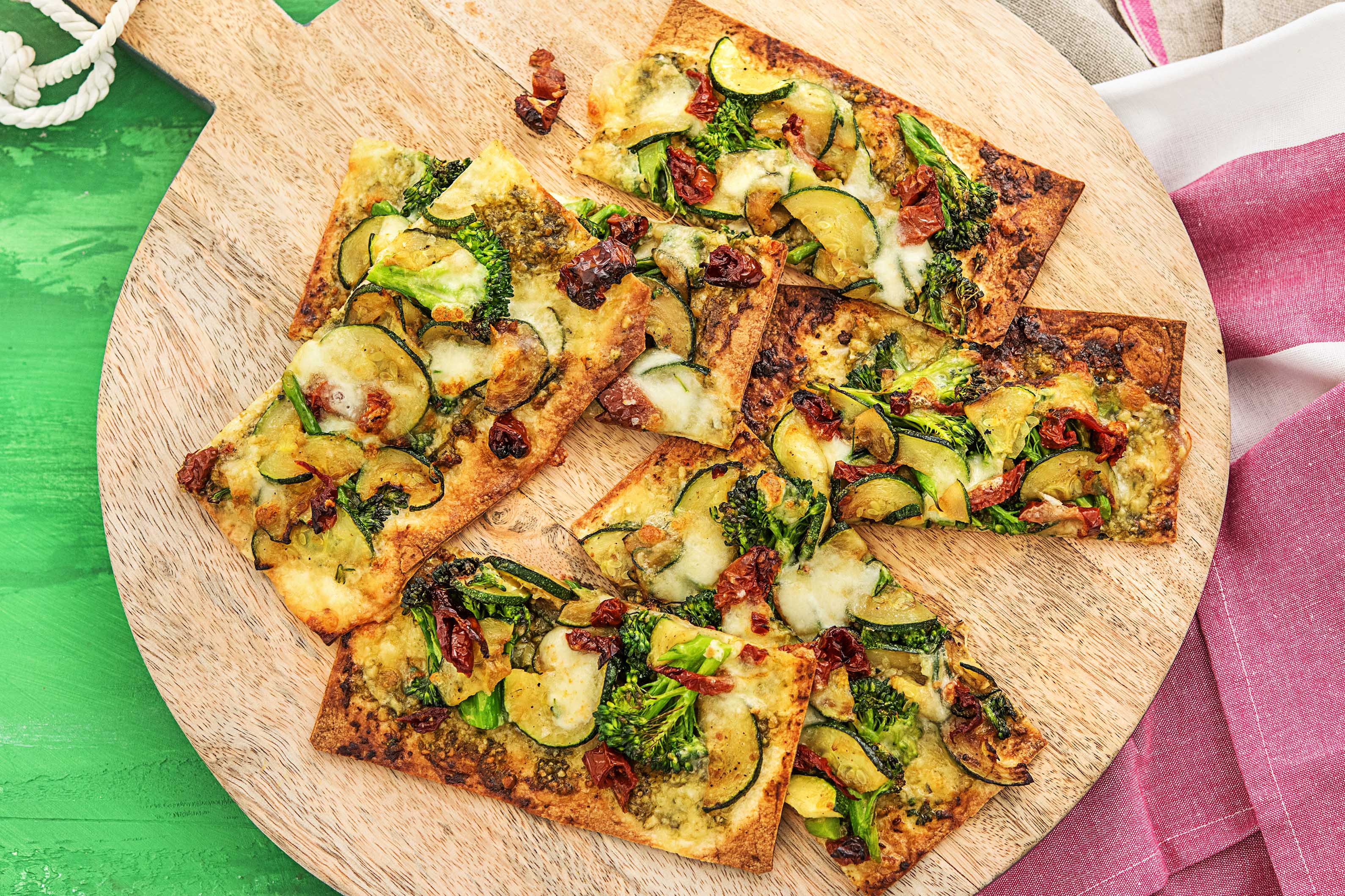 Pesto Pizzas with Sun-Dried Tomatoes Recipe | HelloFresh