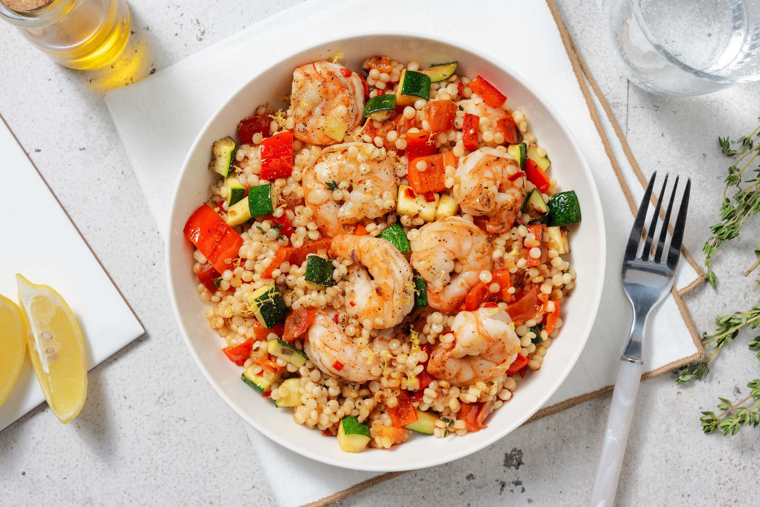 Parelcouscous met garnalen en courgette Recept HelloFresh