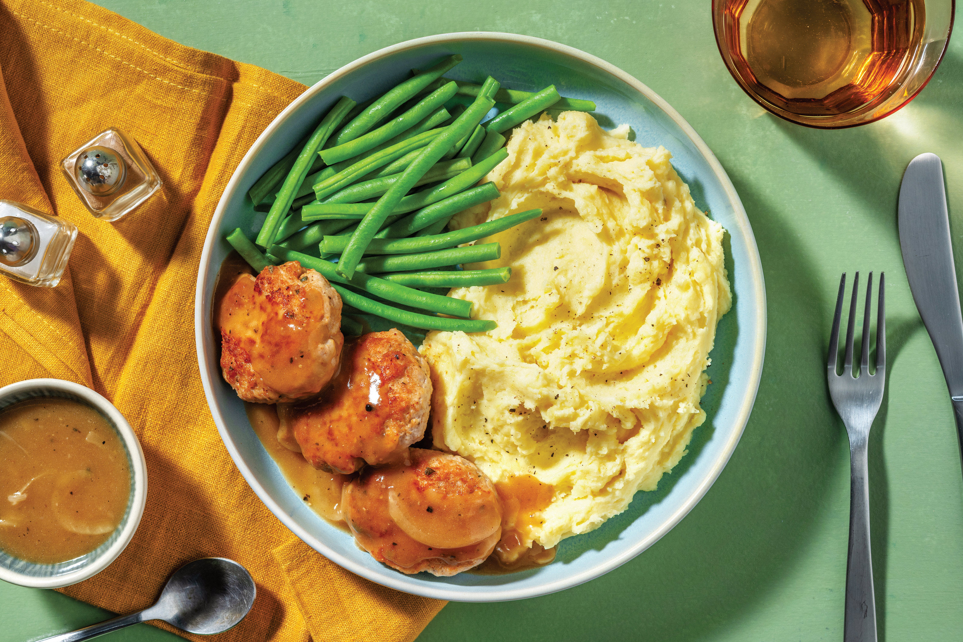 Parmesan Pork Rissoles & Pepper Onion Gravy Recipe HelloFresh