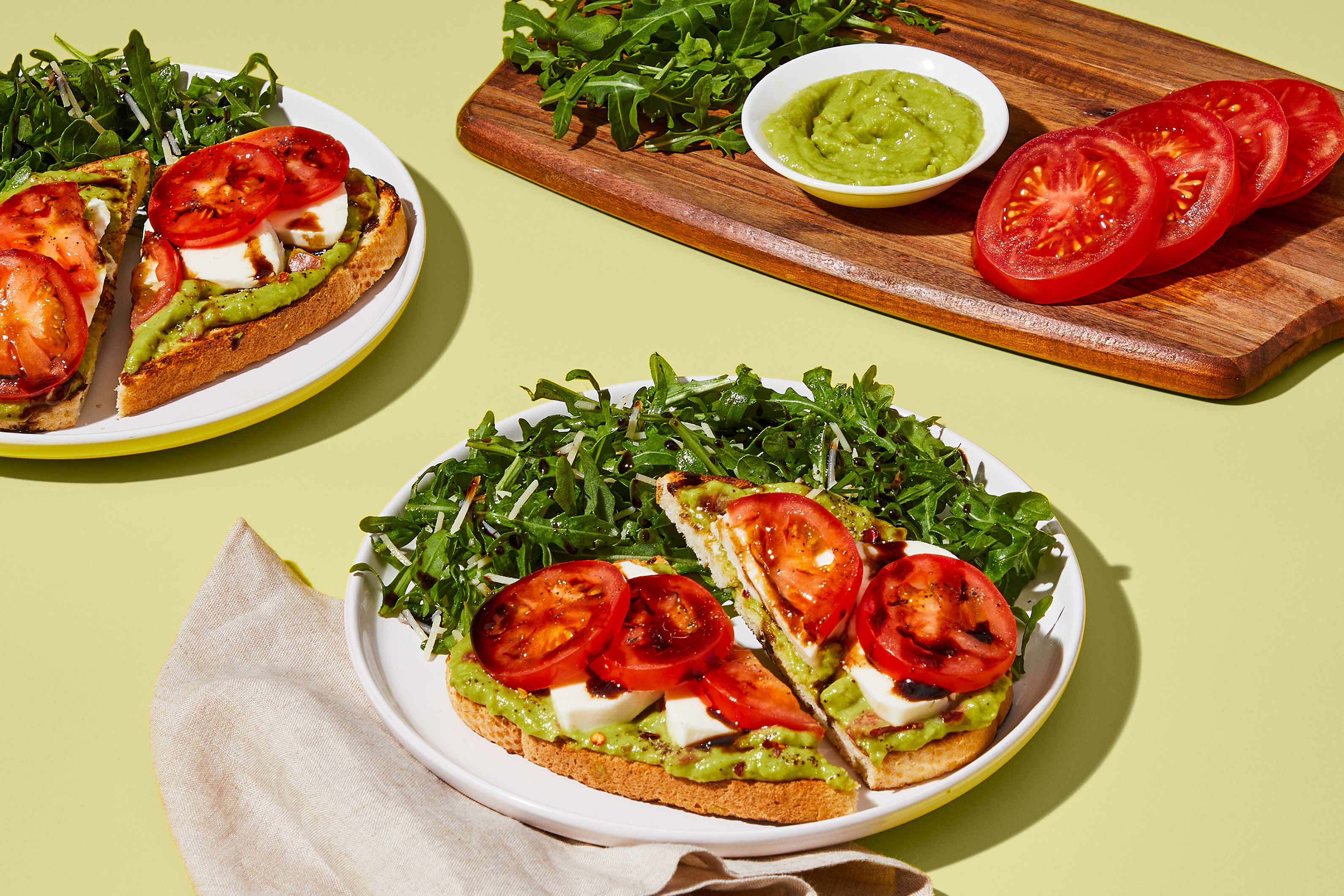 Fresh Mozz Toasts with Guac & Tomato