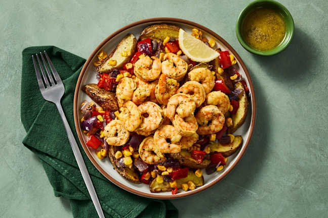 Crevettes au citron et à l’ail, maïs et poivrons