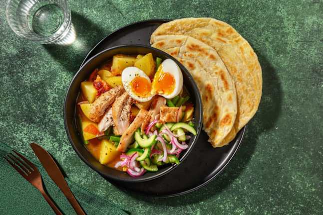 Surinaamse stijl curry met kippendij en roti