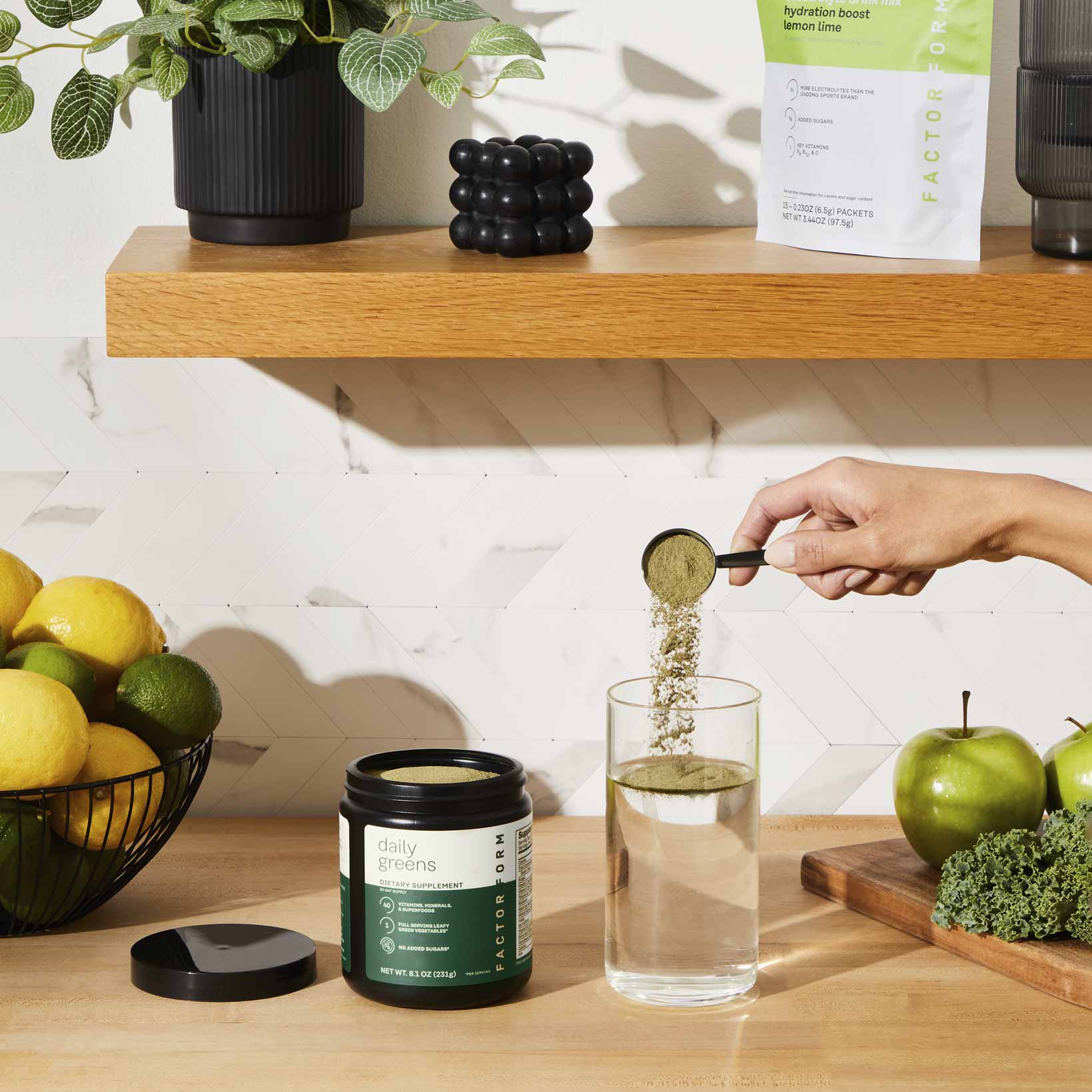 Daily Greens Jar with greens powder pouring into glass with water from scoop