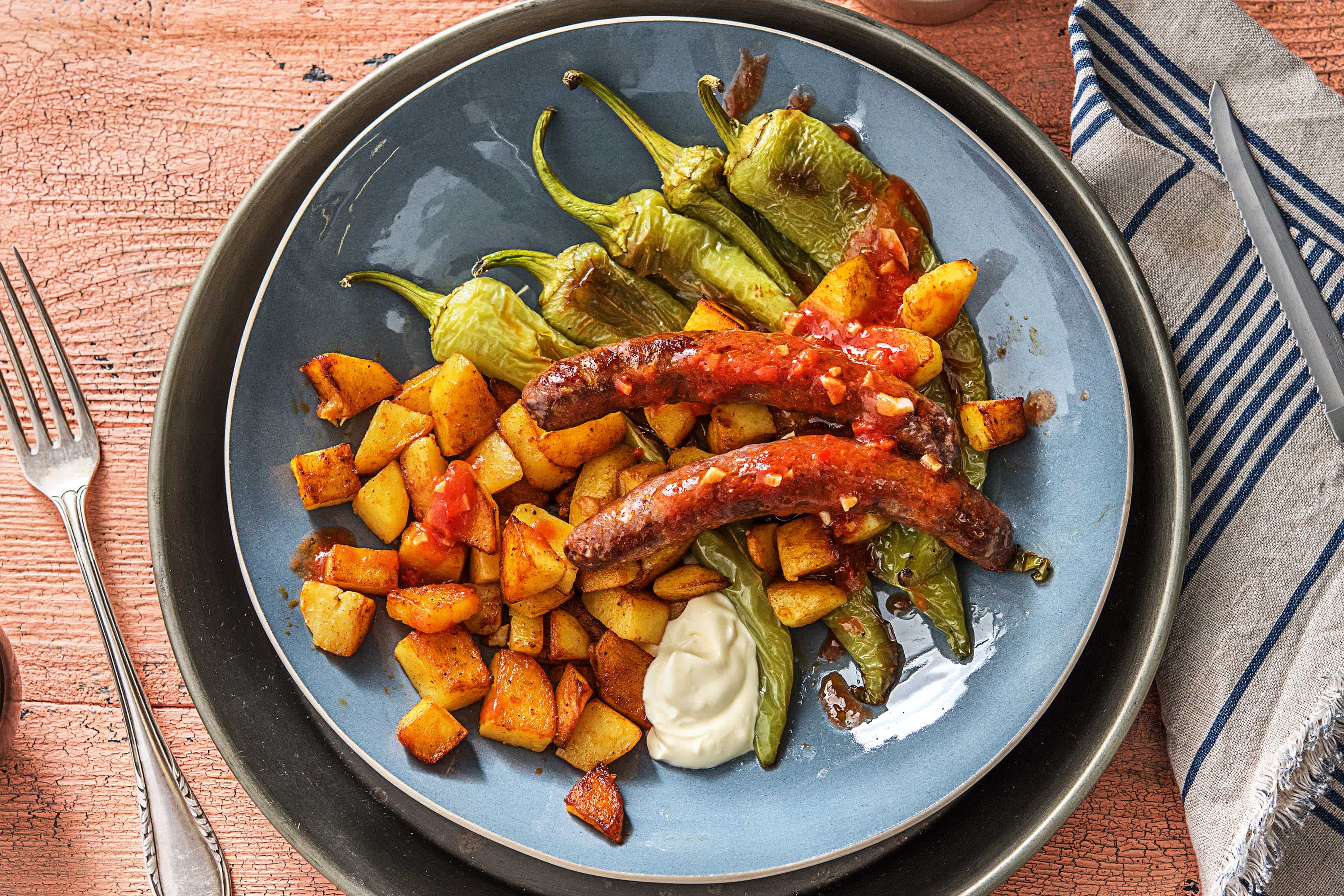 Patatas bravas met rundermerguezworstjes