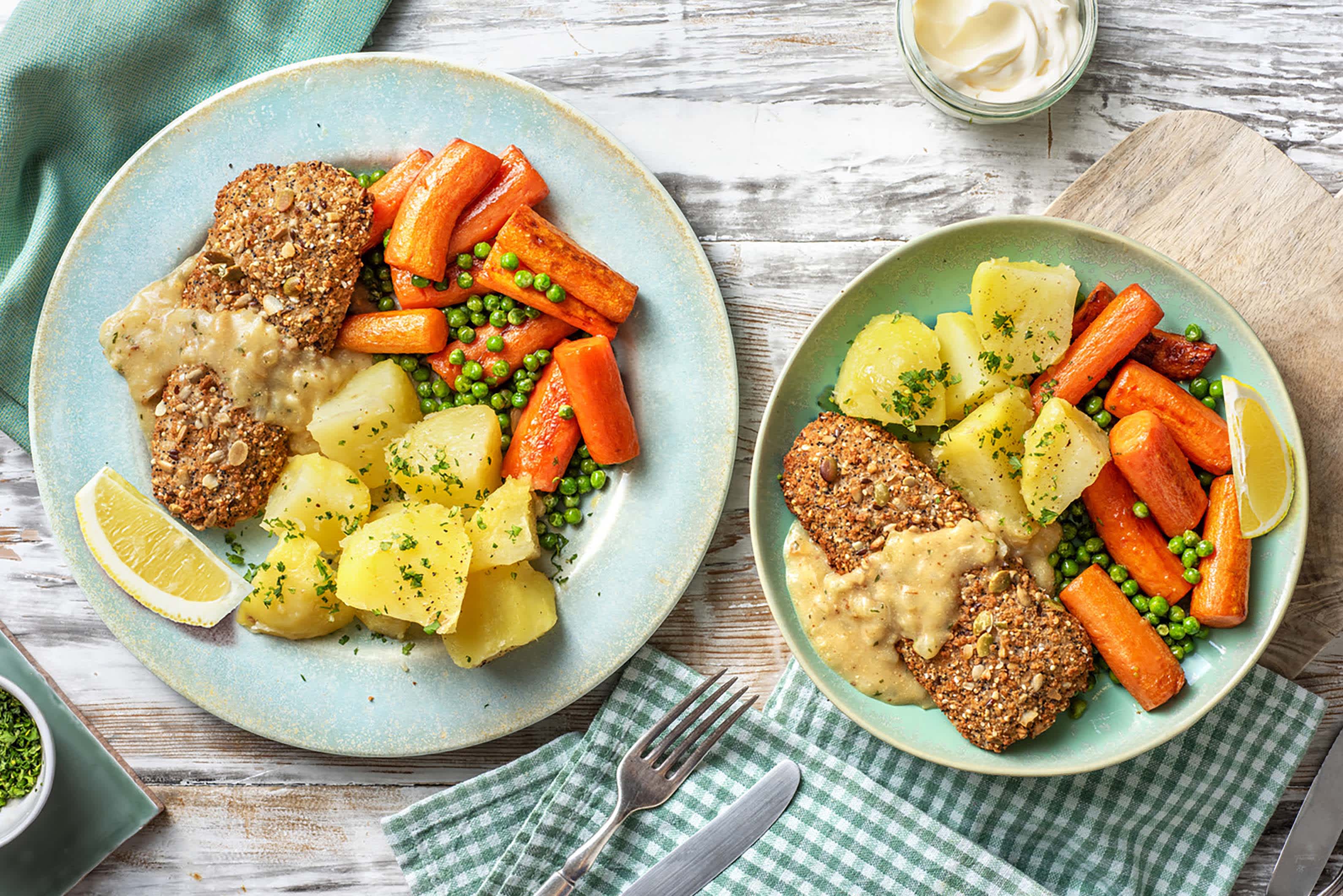Meerzadenvisschnitzel met doperwten en worteltjes
