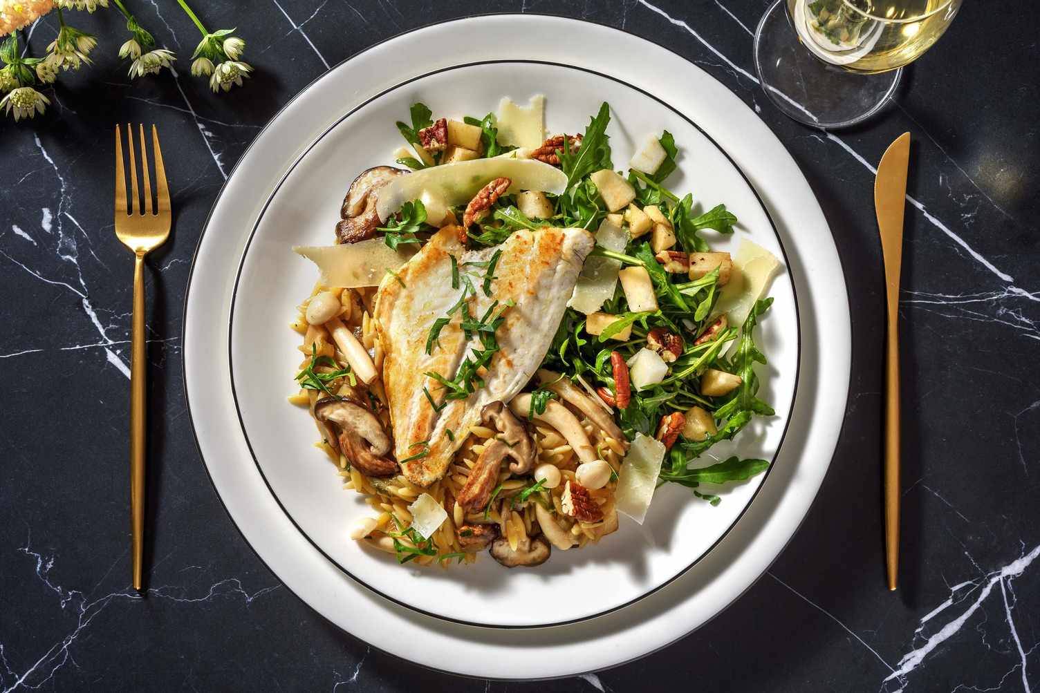 Truffelorzo met doradefilet en paddenstoelen
