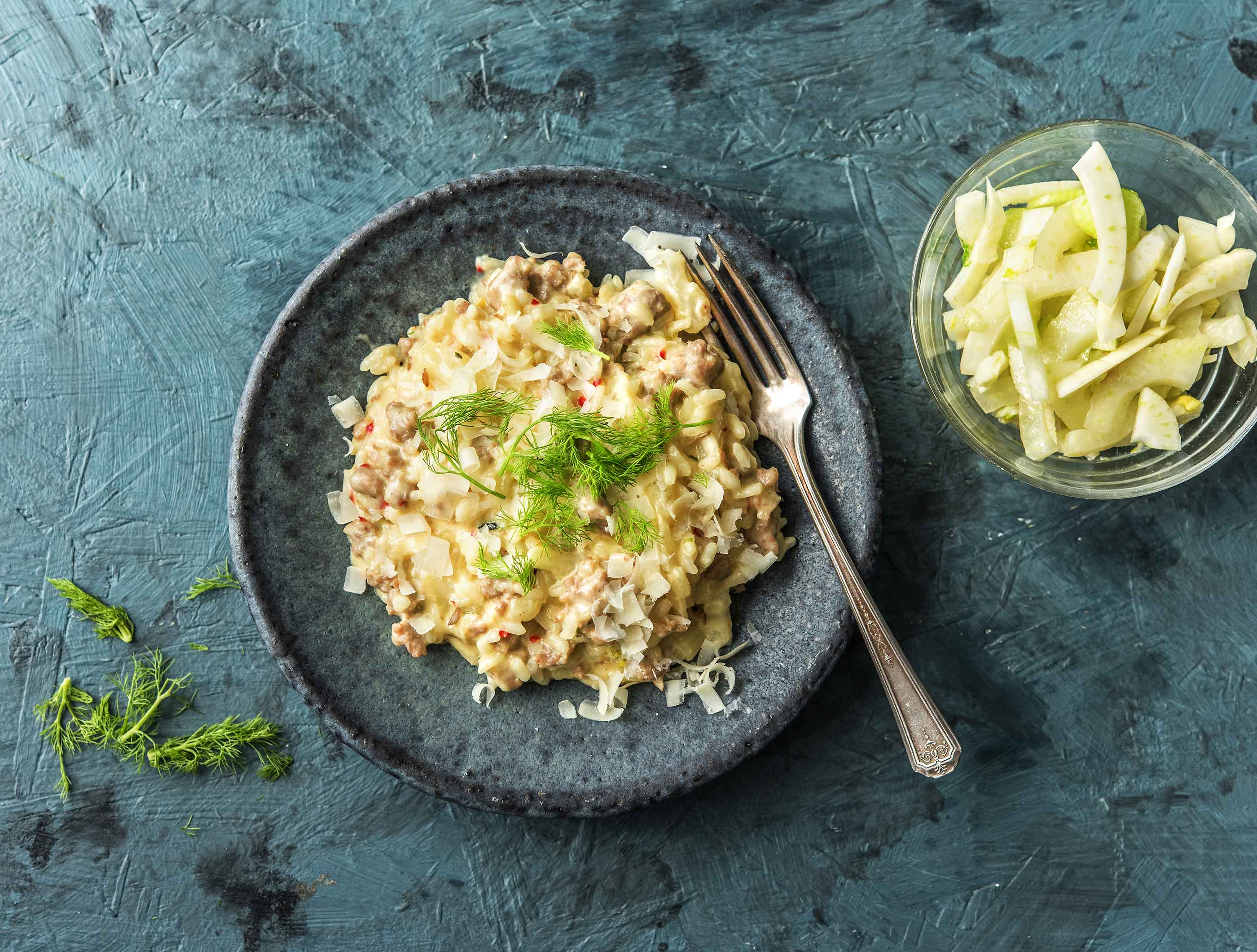 Risotto met gekruide varkensworst, venkelsalade en verse tijm