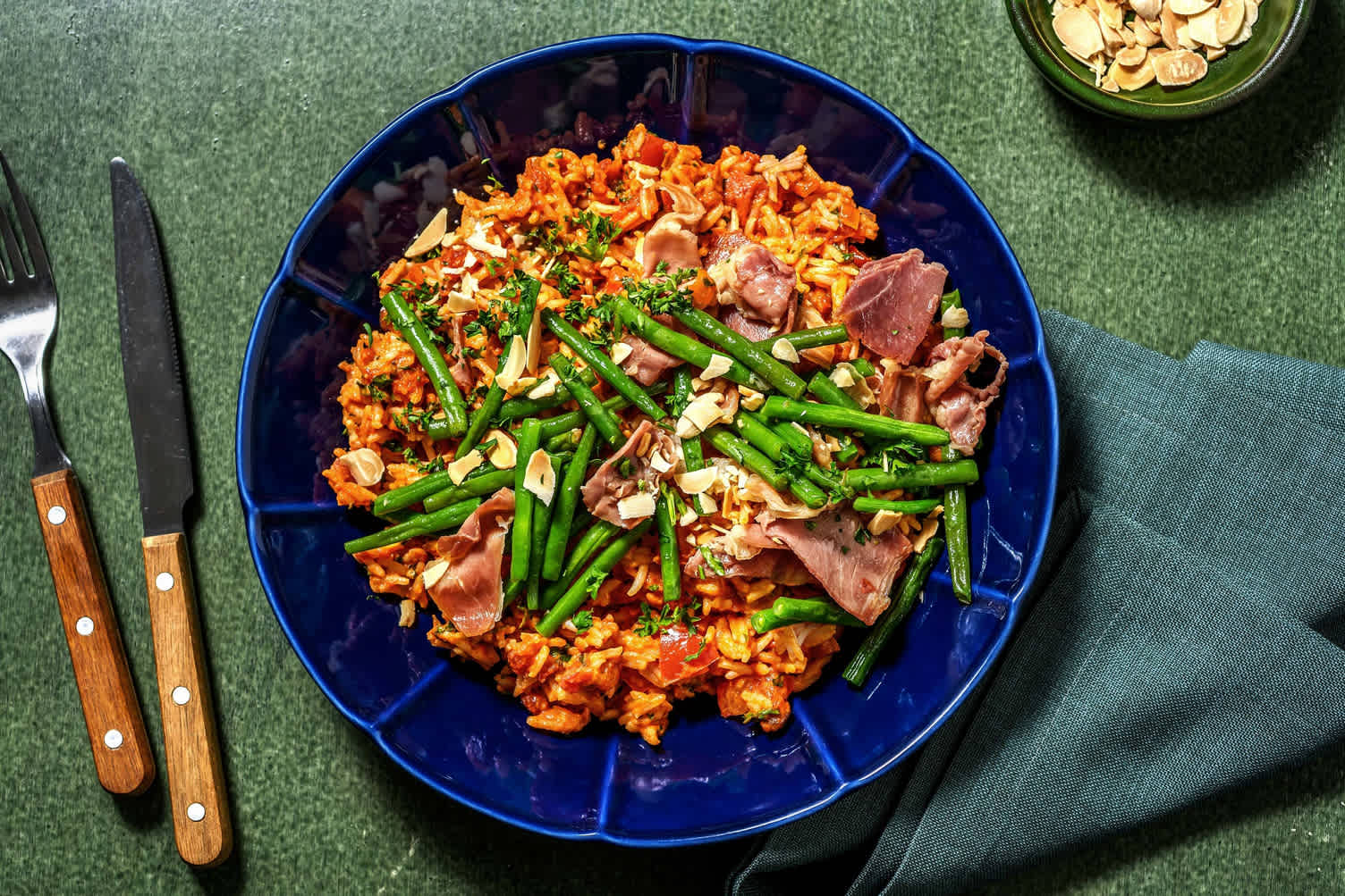 Rijst in tomatenroomsaus met serranoham