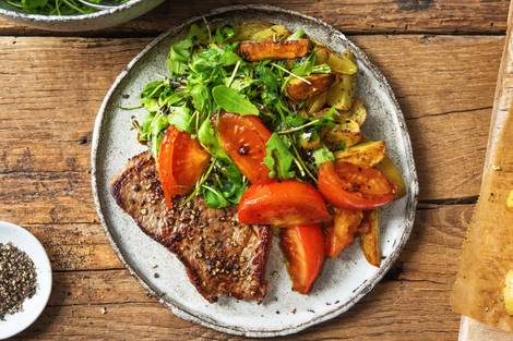 Rindersteak mit geschmorten Tomaten,