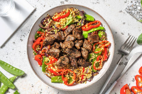 Bulgursalade met biefstukpuntjes en peultjes