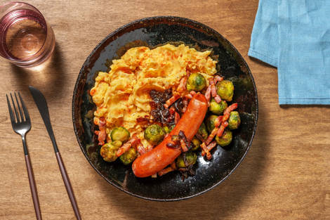 Stoemp de pommes de terre-carotte et saucisse de porc fumée