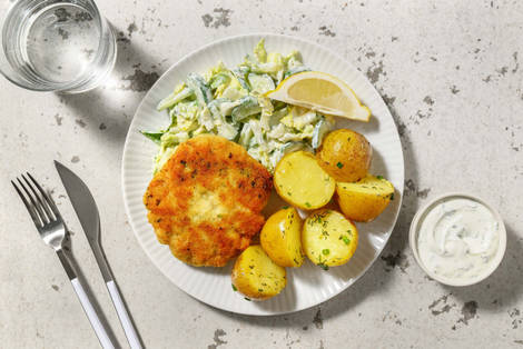 Würzige Fischboulette in Kräuterpanade