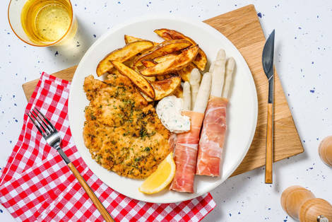 Kräuterschnitzel mit Spargel in Prosciutto