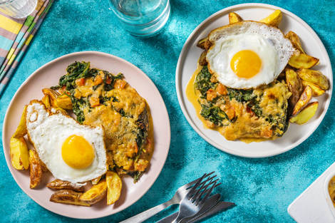 Romige spinaziegratin met spiegelei