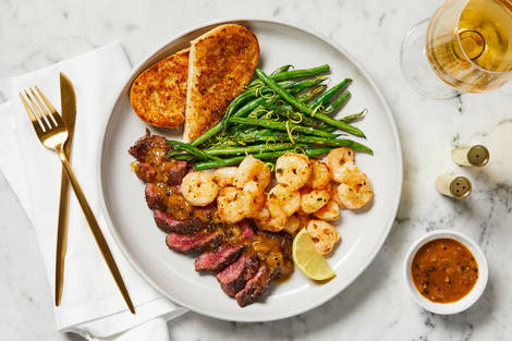 Steak au Poivre & Garlic Herb Shrimp