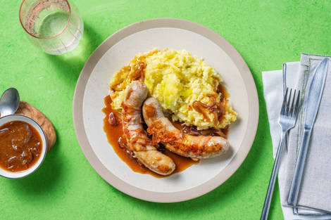 Prei-pastinaakstamppot met varkensworstjes in spek