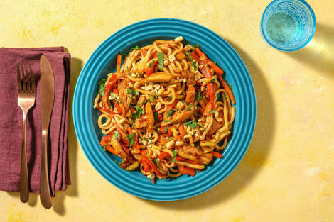 Wok à l’émincé de cuisse de poulet et aux nouilles udon