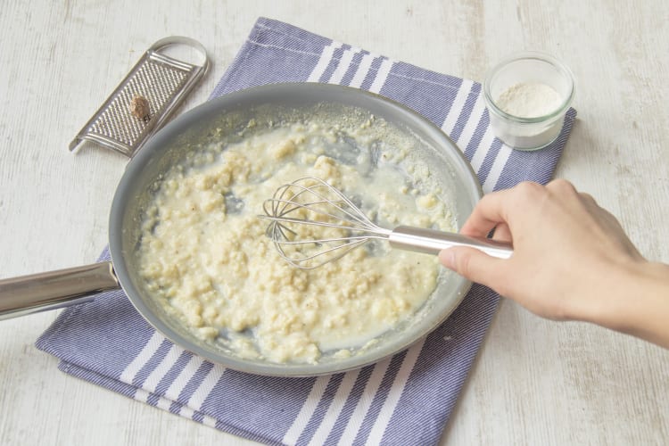 Stir the yoghurt, parmesan, milk, and mozarella in a saucepan