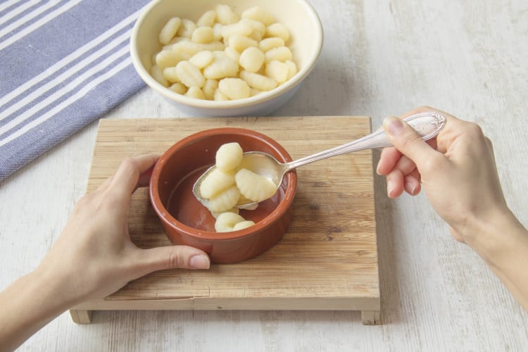 Put gnocchi in an ovenproof dish