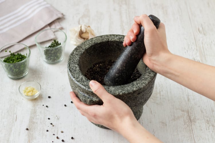 Crack the peppercorns in a pestle and mortar
