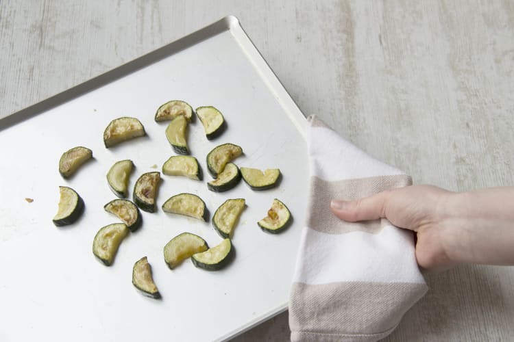 Lay out zucchini on a baking sheet and roast them