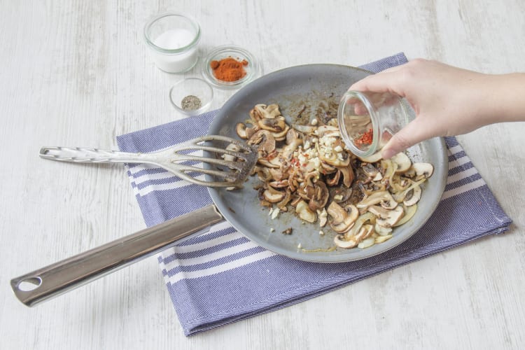 Add spices to mushrooms