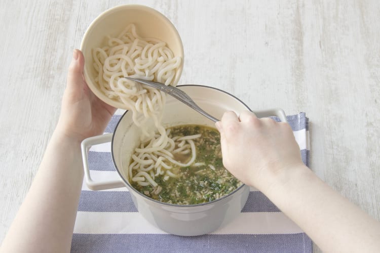 Add udon noodles and cook until al dente