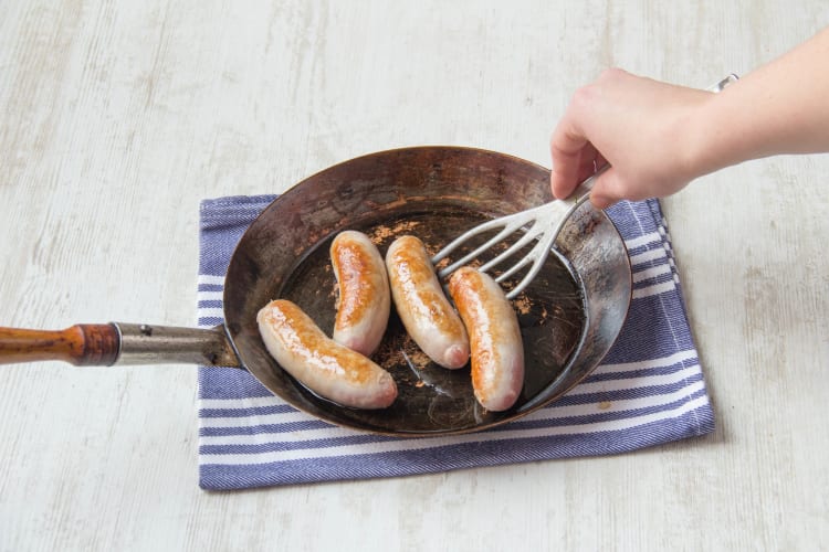Cook sausages in a pan