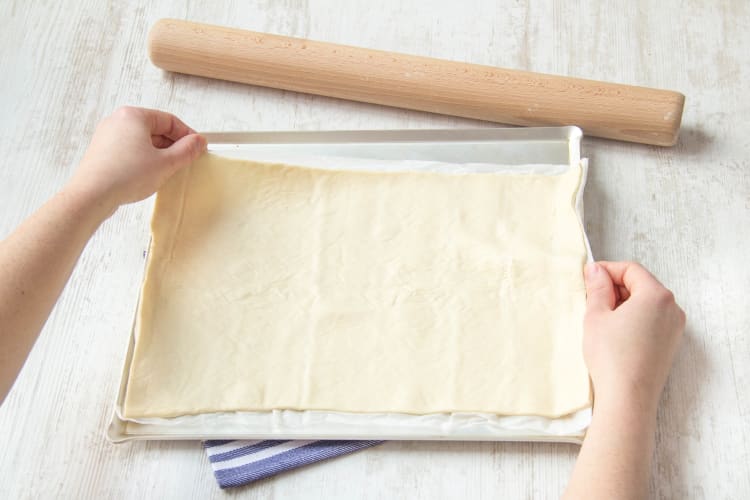 Strech pizza dough to form a rectangle