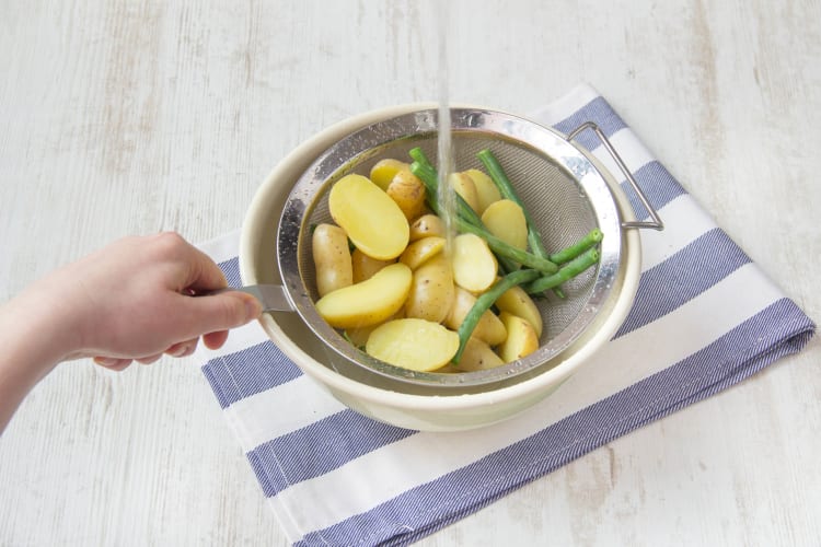 Boil potatoes and green beans