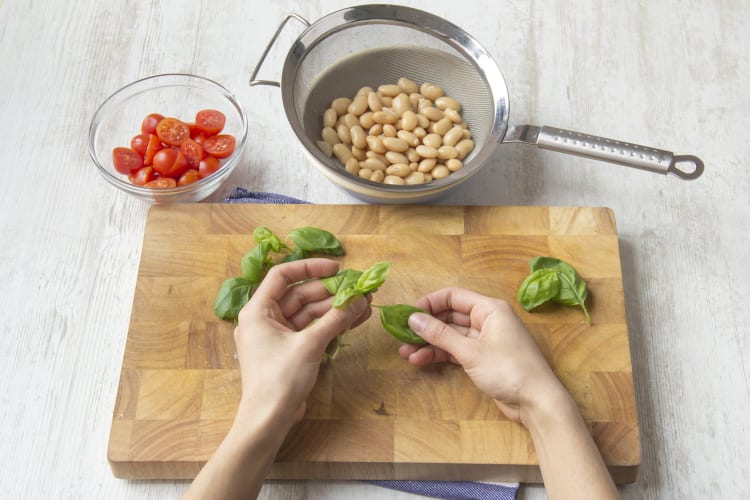 Tear the basil leaves