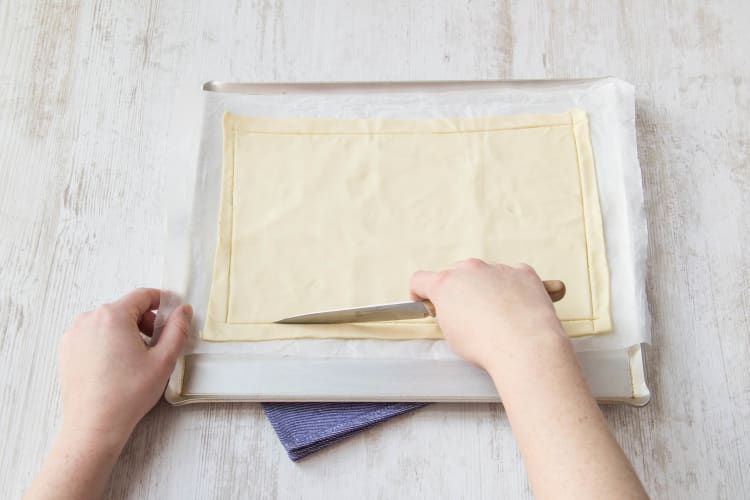Unroll the pastry onto a lightly greased baking tray