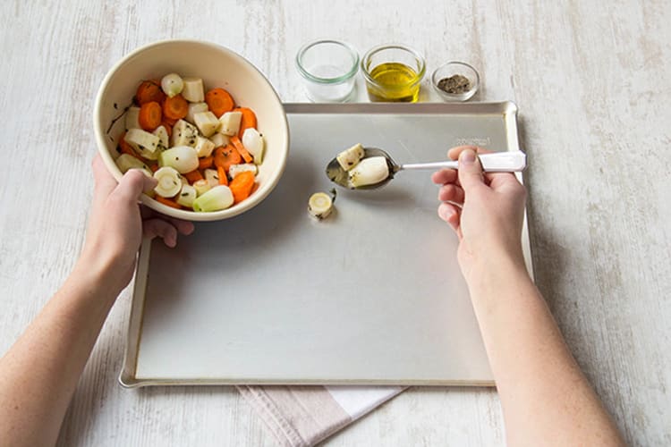 Toss the vegetables on the baking sheet