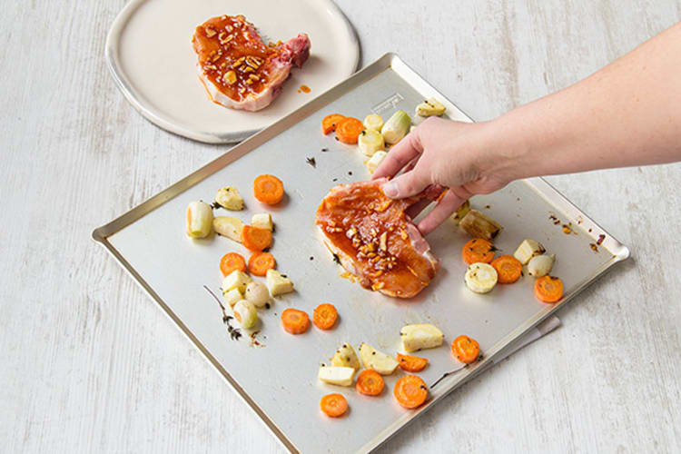 Place the pork onto the center of the baking sheet