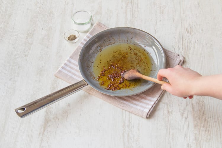 Stir the cumin and chili flakes in olive oil