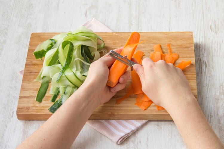 Peel and cut carrot and cucumber