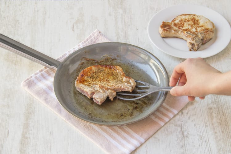 Sear pork chops in a pan