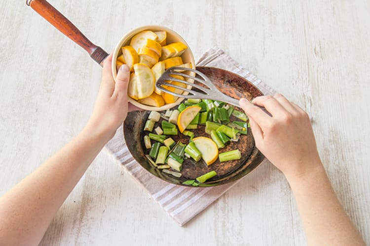 Cook scallions, squash and garlic in a pan