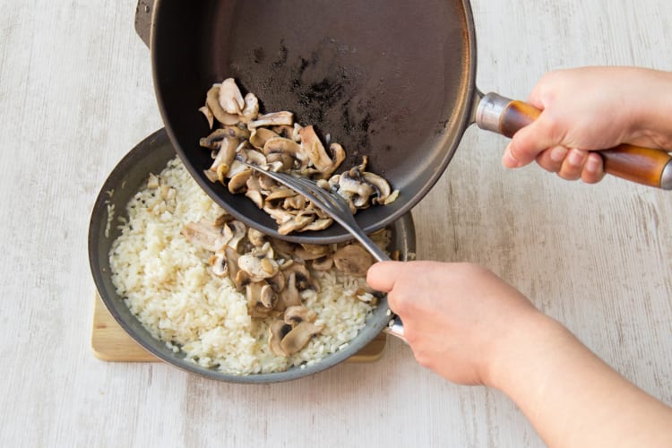 Add the mushrooms to the risotto