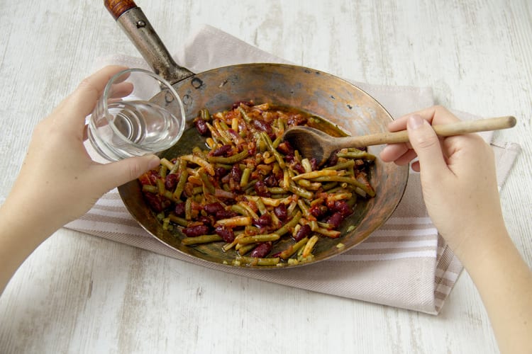 Add water to bean mix