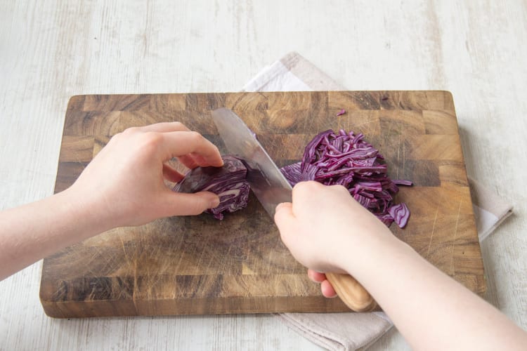 Thinly slice red cabbage