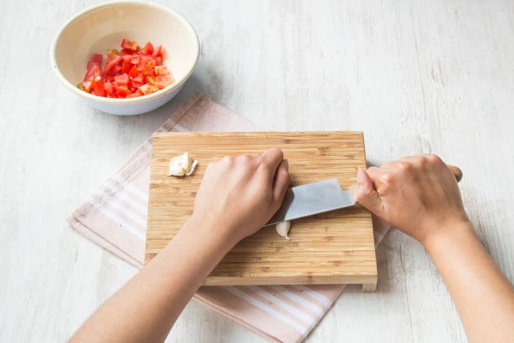 Cut the tomatoes and garlic