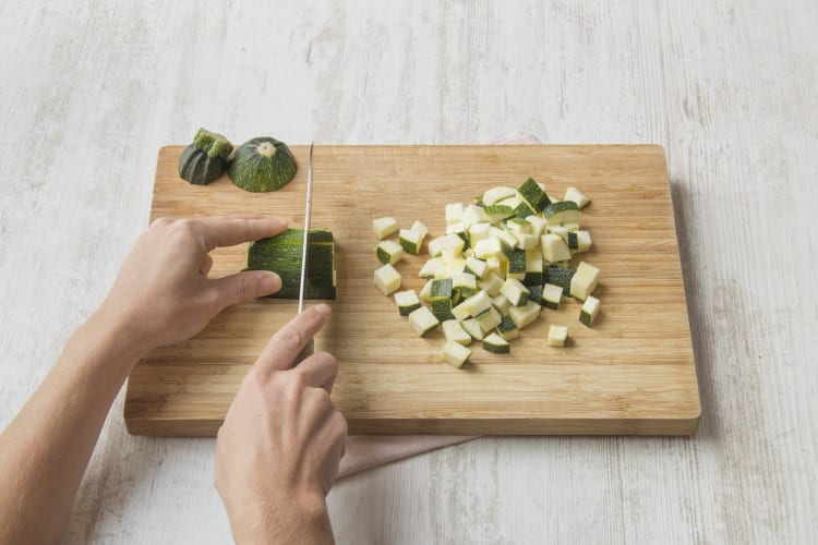 Chop courgettes