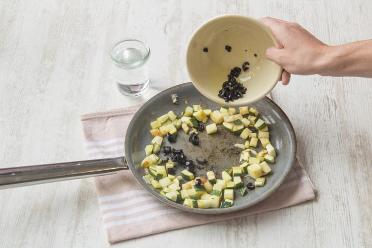 Add the olives back into the pan