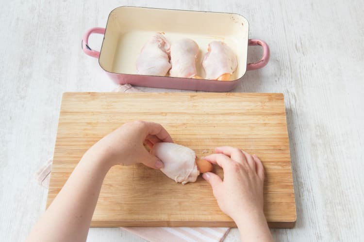 Roll your sausages in the chicken thighs