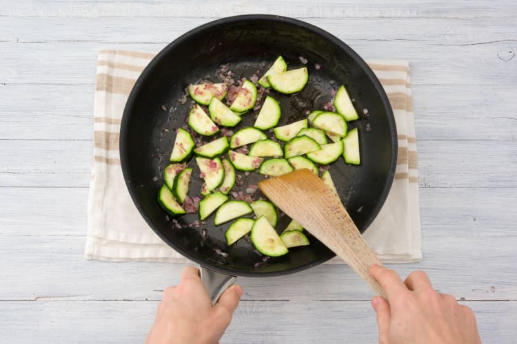 Cook the onion and zucchini
