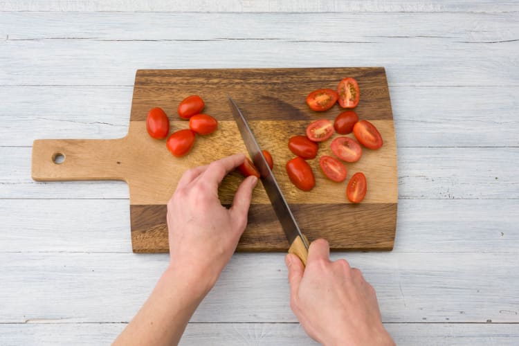 Halve the grape tomatoes