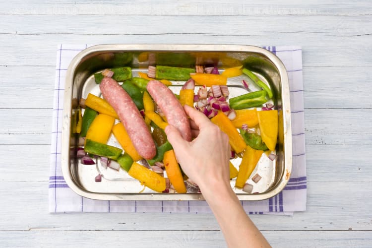 Pop your sausages on top of the veggies