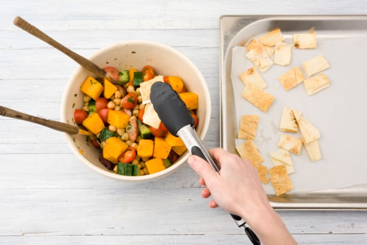 Toss the pumpkin & Lebanese bread through the salad